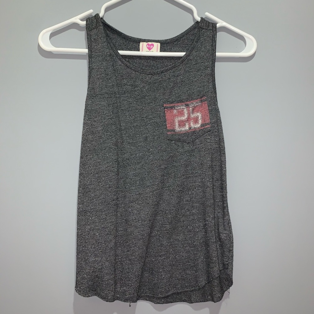 a gray tank top with a number in the pocket